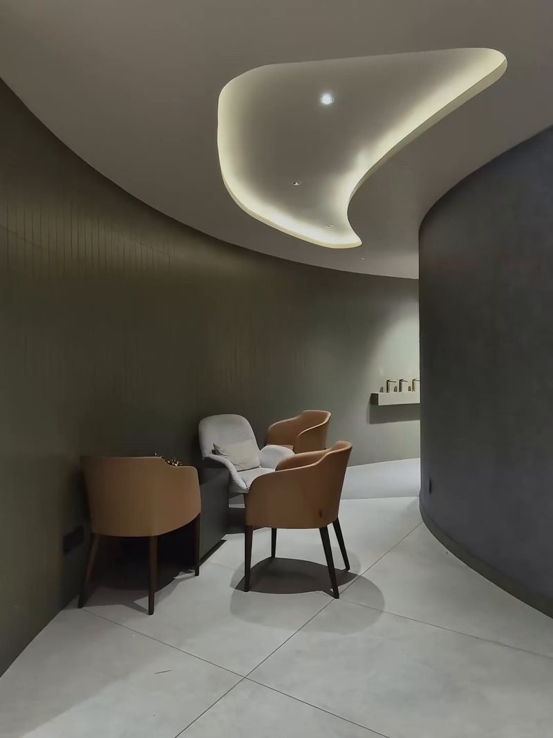 Curved ceiling and lounge in a showroom interior