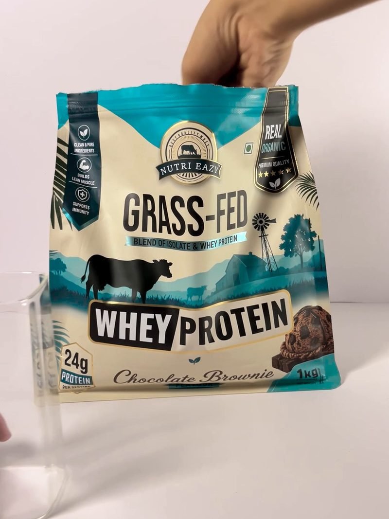 Whey protein pouch held over a table